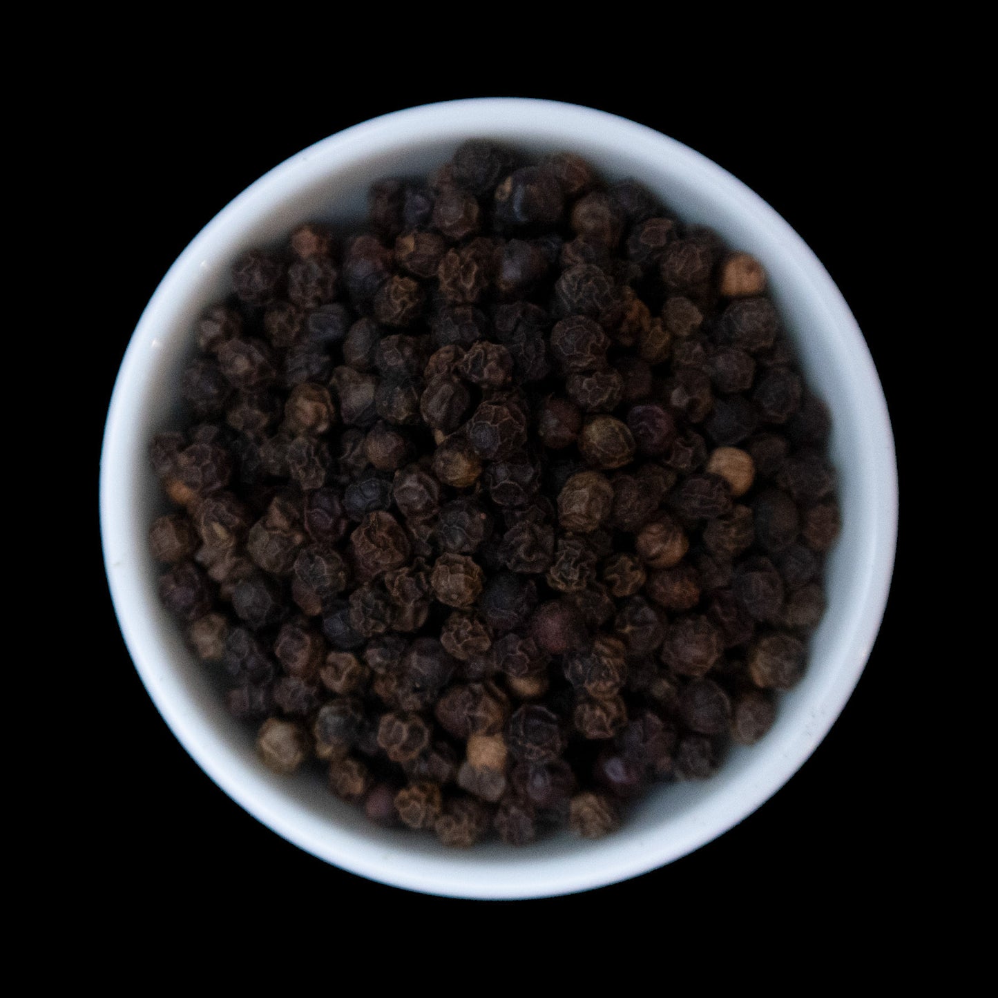 Whole black peppercorns