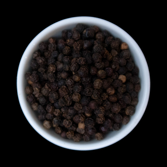 Whole black peppercorns
