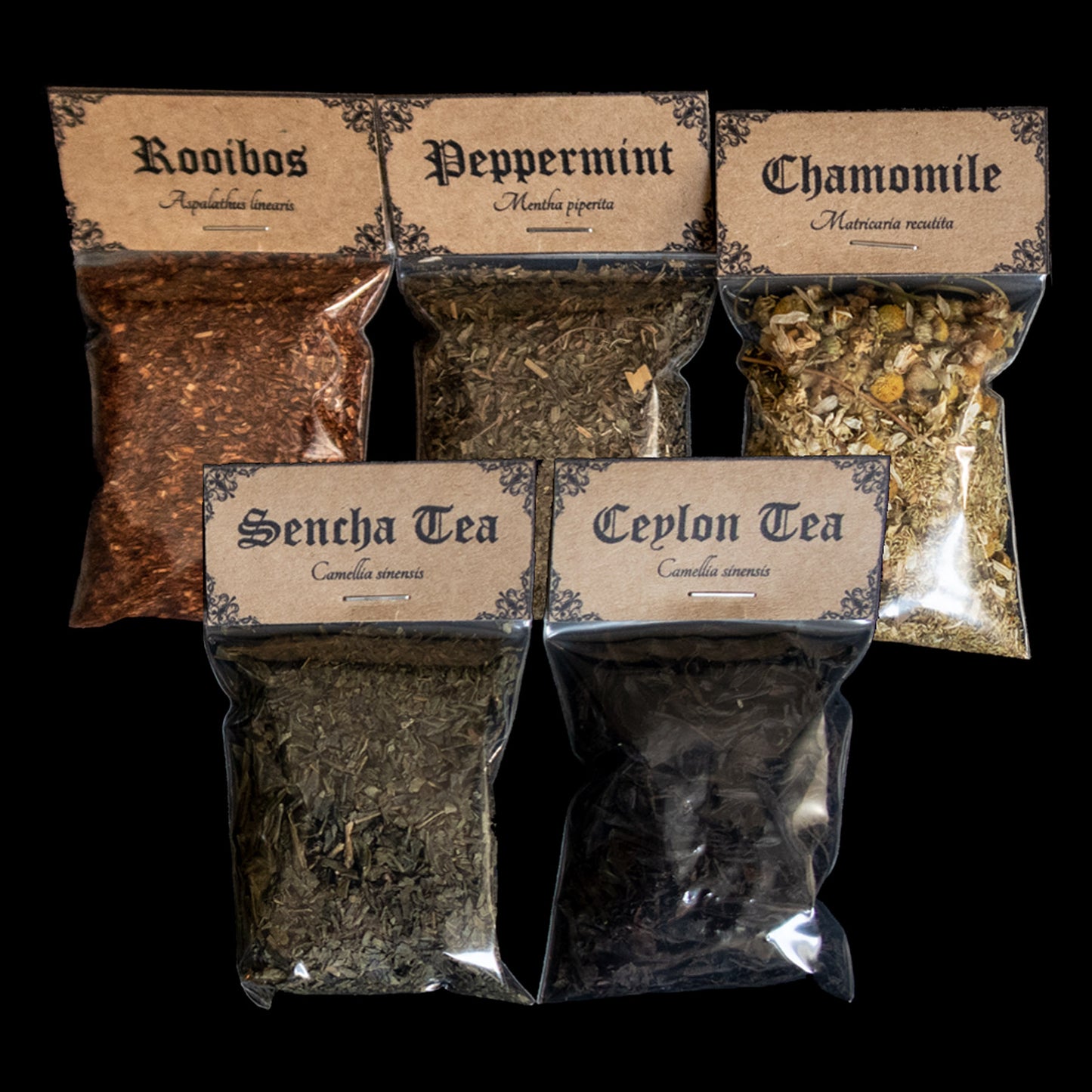A collection of 5 bags of herbs - Victorian-apothecary-style brown labels at the top give the common and Latin names