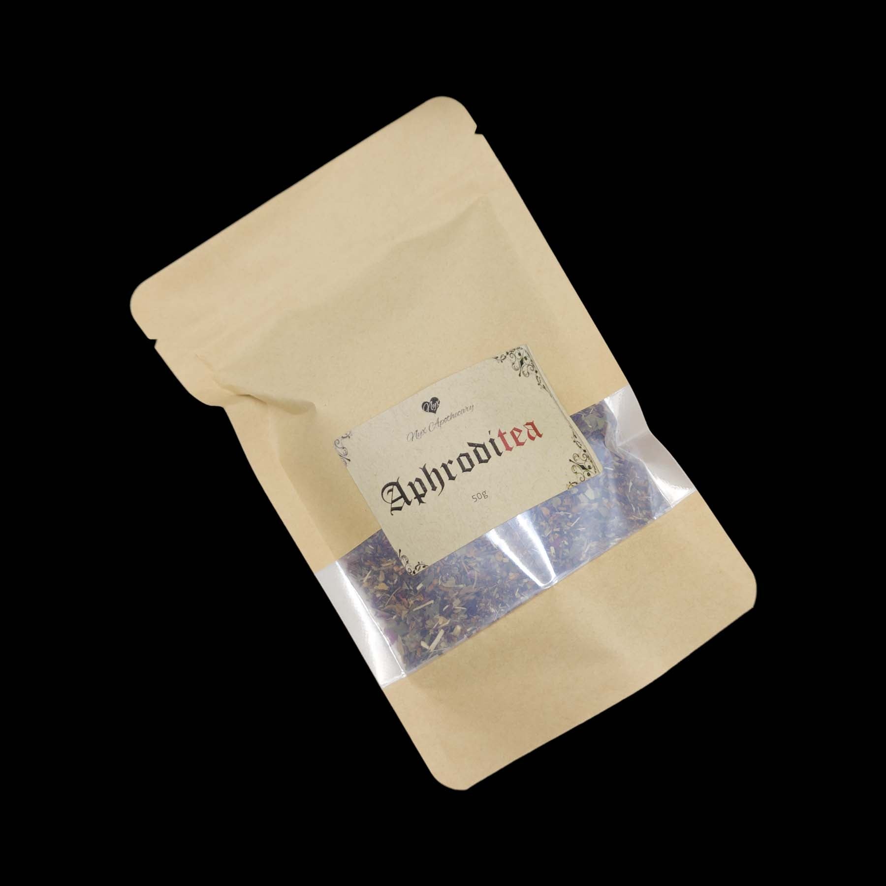 A kraft bag labelled Aphroditea with a clear window showing the tea