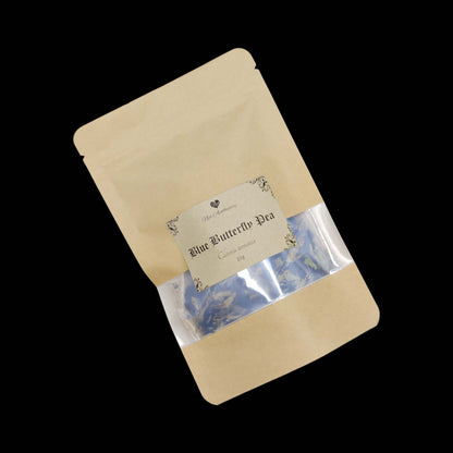 A kraft bag labelled Blue Butterfly Tea with a clear window showing the tea