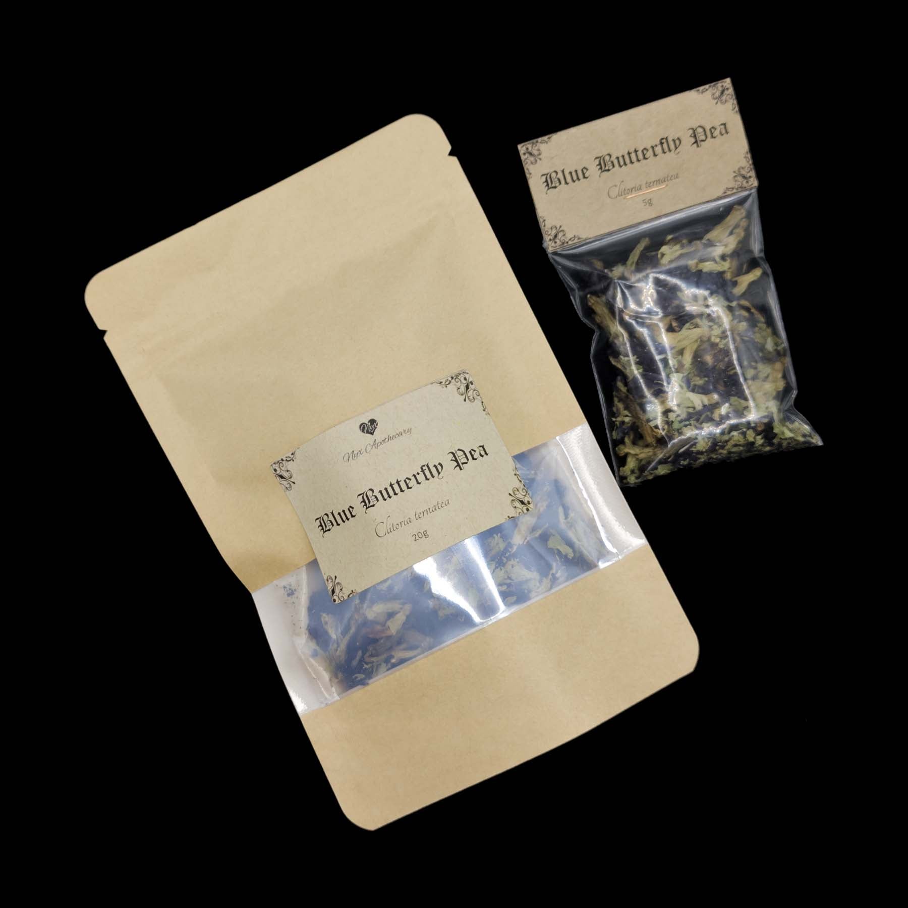 Two bags of blue butterfly pea flowers, one small and clear, the other a larger kraft bag with a clear window. 