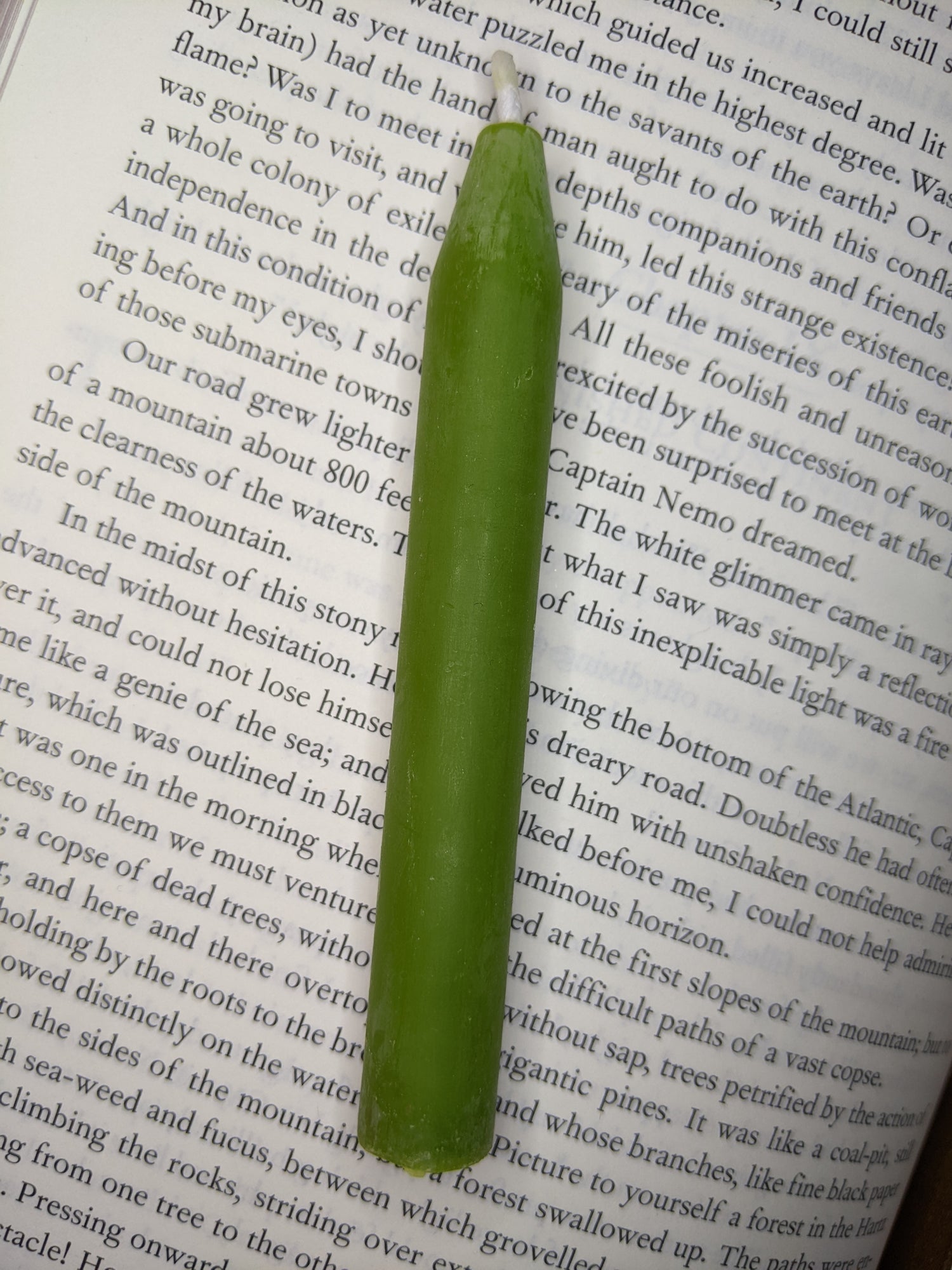 A lime green beeswax chime candle