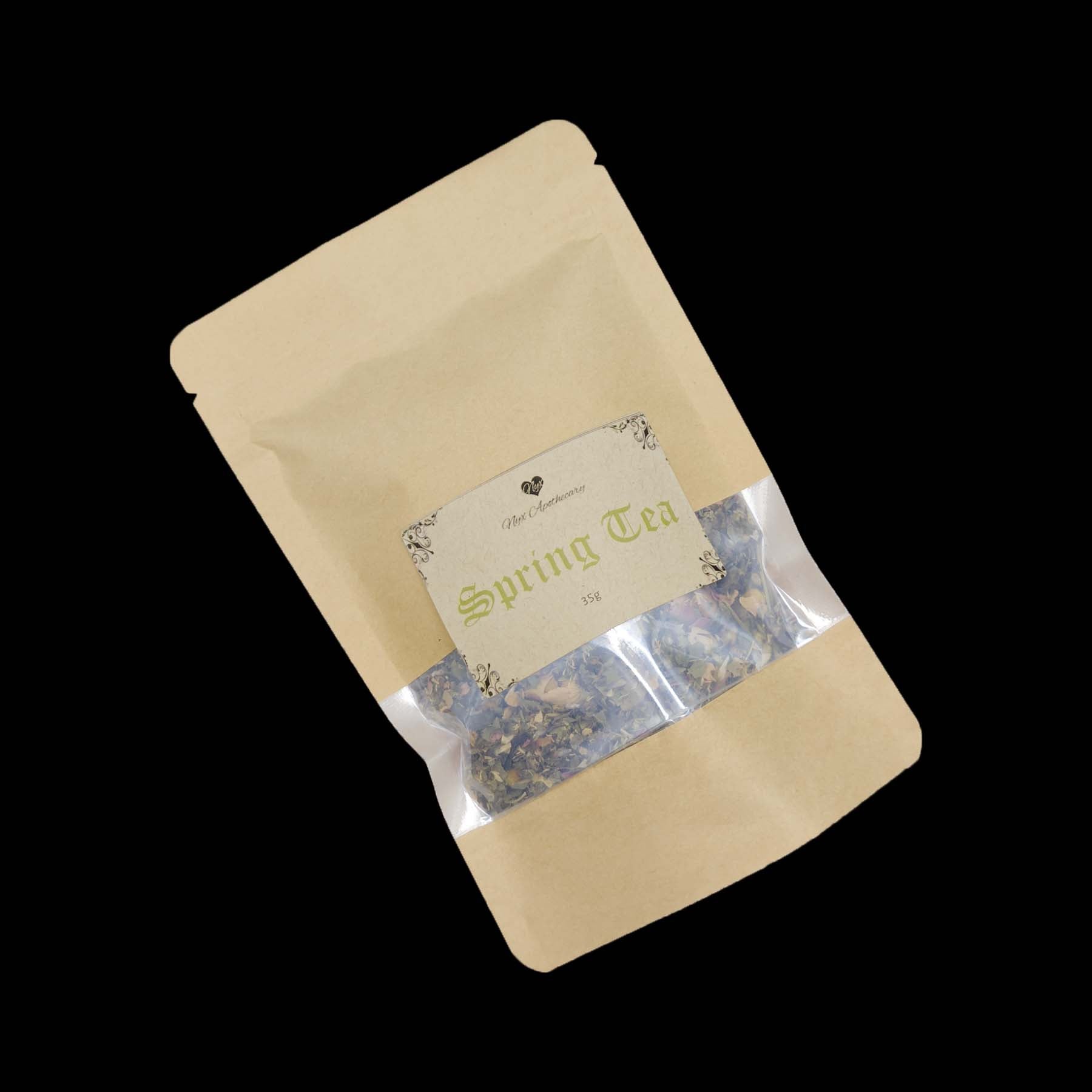 A kraft bag labelled Spring Tea with a clear window showing the tea
