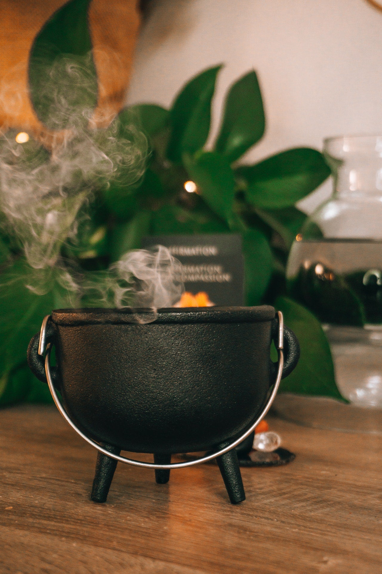 Smoke rising from a small cauldron