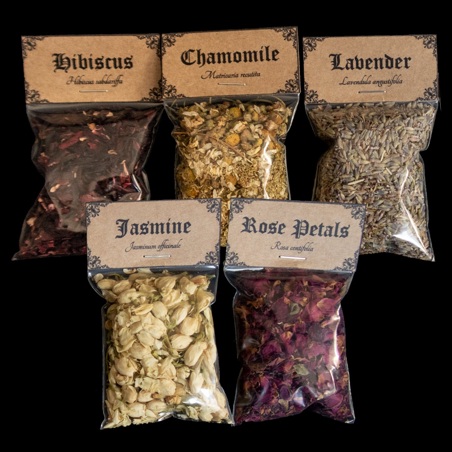 A collection of 5 bags of herbs - Victorian-apothecary-style brown labels at the top give the common and Latin names