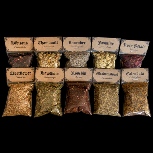 A collection of 10 bags of herbs - Victorian-apothecary-style brown labels at the top give the common and Latin names