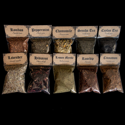 A collection of 10 bags of herbs - Victorian-apothecary-style brown labels at the top give the common and Latin names